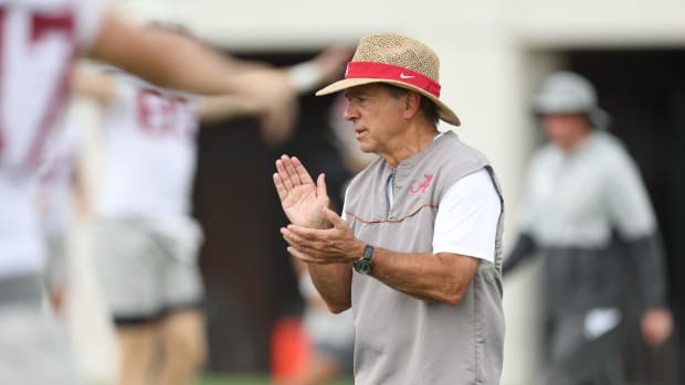 Nick Saban claps at practice